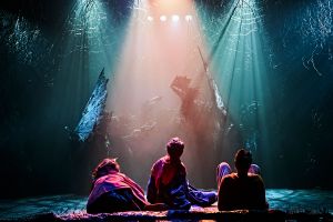 actors onstage at theatre for assisted performance
