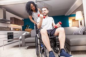 Disabled man in wheelchair with his girlfriend